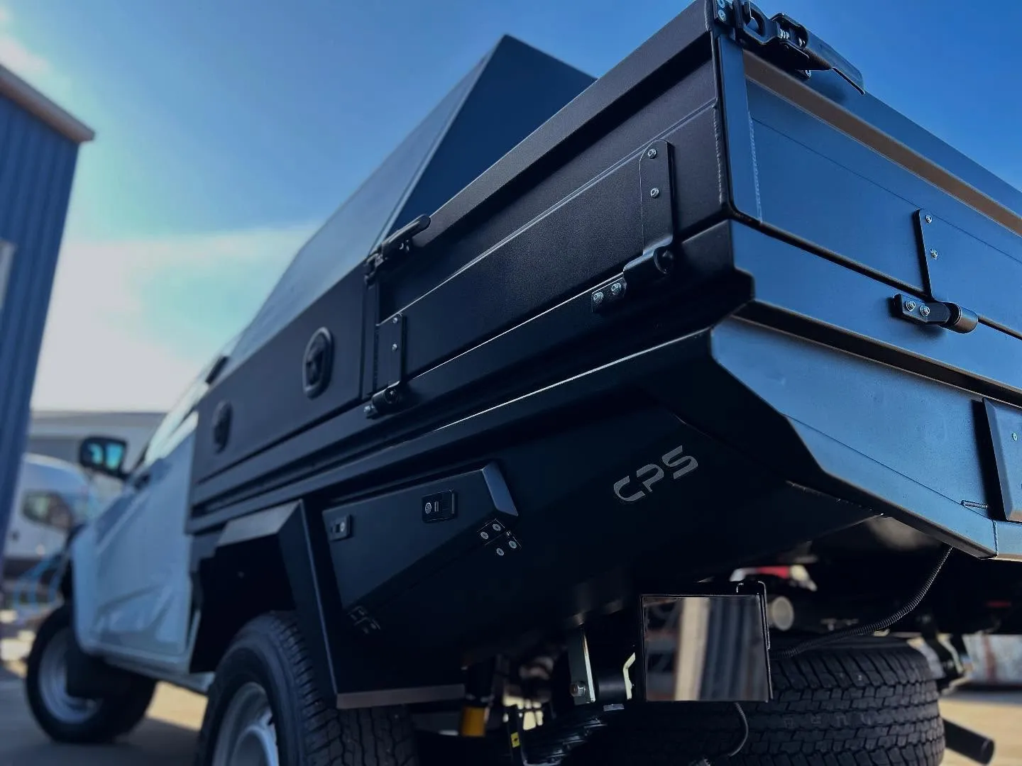 Black custom CPS dog box and flat deck