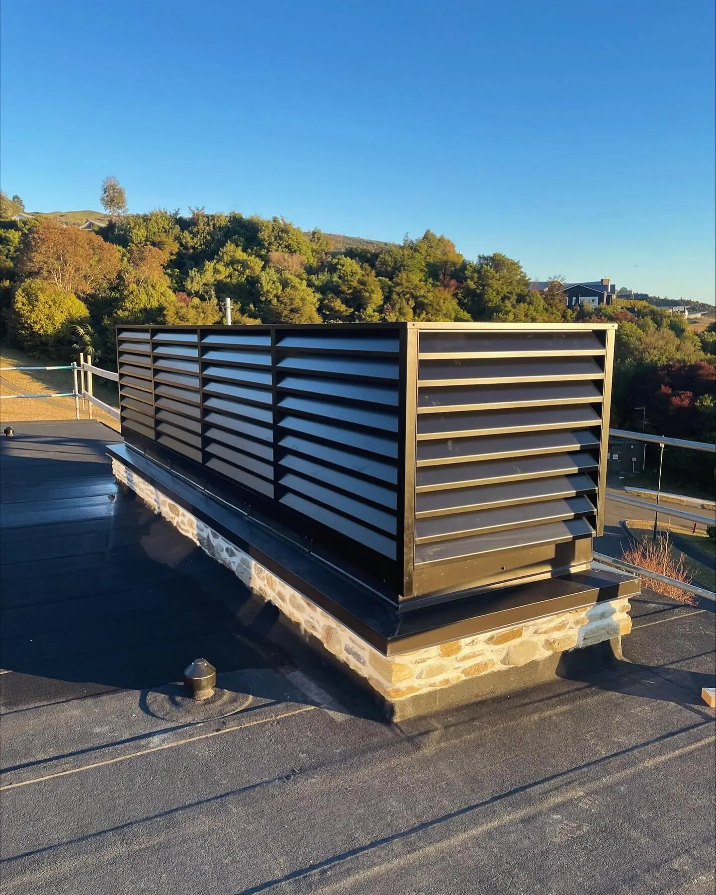 Custom metal louvred screen installed on a rooftop